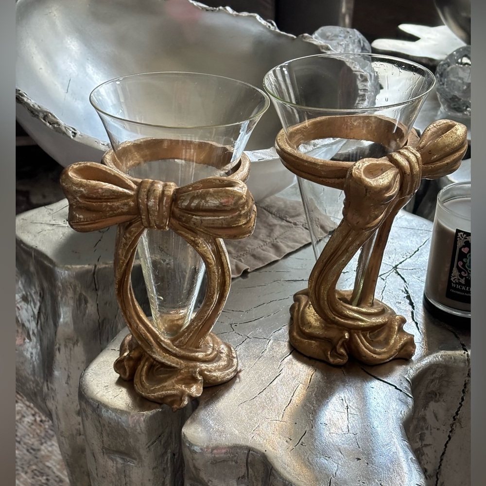 A pair of pretty gold things will hold candle, tea light or potpourri or flowers